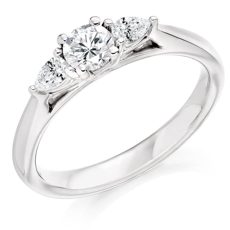 PLT 0.50CT DIA ROUND AND PEAR CUT TRIL RING